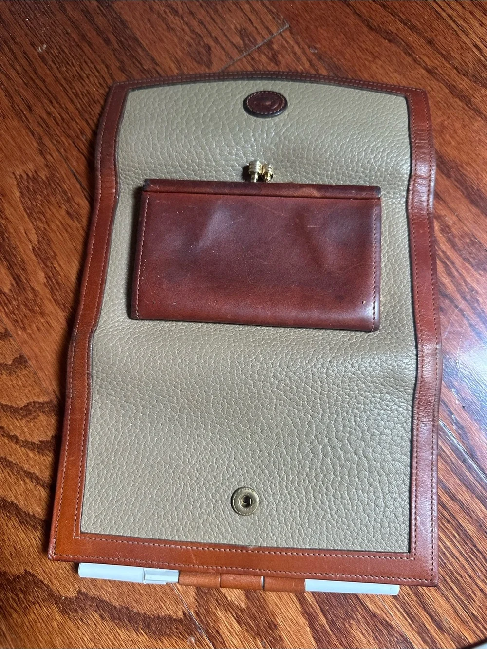 Dooney & Bourke Classic Pebbled Leather Wallet with Brown Trim